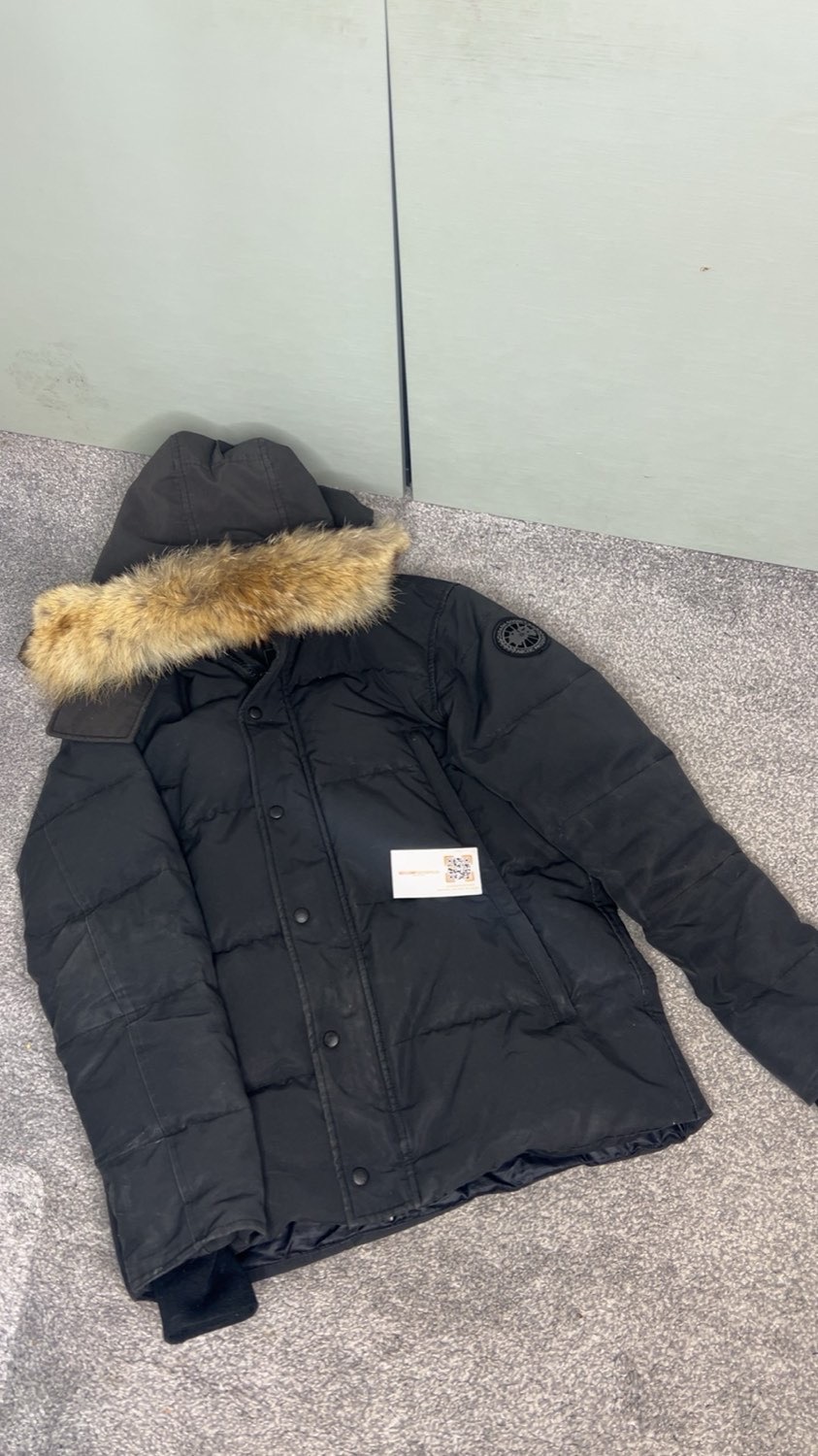 Black down parka with a fur-trimmed hood